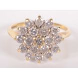 An 18ct gold and diamond cluster ring.