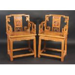 A pair of Chinese armchairs, 19th century, the vertical splat carved with a figure of a lady,