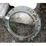 A brass porthole, inscribed 'OPR' and 'DT', impressed numbers 27 and 15, diameter 48cm.