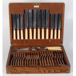 A Mappin & Webb oak canteen of silver plated cutlery, 32 x 39cm.