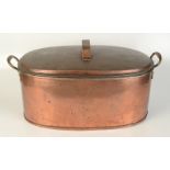 A large oval copper kettle with twin brass handles, the lid with copper strap handle, 32 x 56cm.