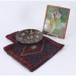 An Indian papier mache dish, diameter 25cm, a picture 28.5 x 22.5cm and a Persian salt bag, 51 x 39.