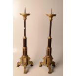 A pair of wooden gilt and brown painted pricket candlesticks in Gothic style, height 78.5cm.