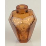 An amber glass snuff bottle with gold flake inclusions, height 6.4cm.