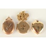 Three gold mounted lockets and one gold chain.