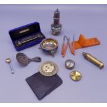 A miniature brass compass, diameter 3cm, a Hohner blues harp mouth organ, silver plate etc.
