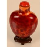 A Chinese Qianlong period Realgar glass snuff bottle, height 6.