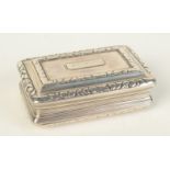 A George III silver snuff box with engine turning, reeded body and cast chased borders,
