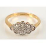 An 18ct gold diamond cluster ring.