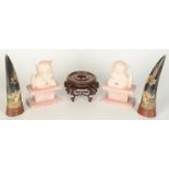 A pair of Chinese soapstone dogs on fo on rose quartz plinths, height 16cm,