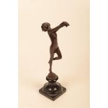 A bronze Art Deco style figure of a naked lady, on a black marble plinth base, height 23cm.