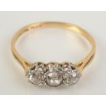 An 18ct gold ring set three diamonds, size Q.