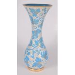 A continental blue glass vase, with white overlaid enamel and gilt leaf decoration, height 45cm,