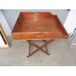 A Victorian mahogany butler's tray on stand, total height 84cm, length 67cm, width 54cm.