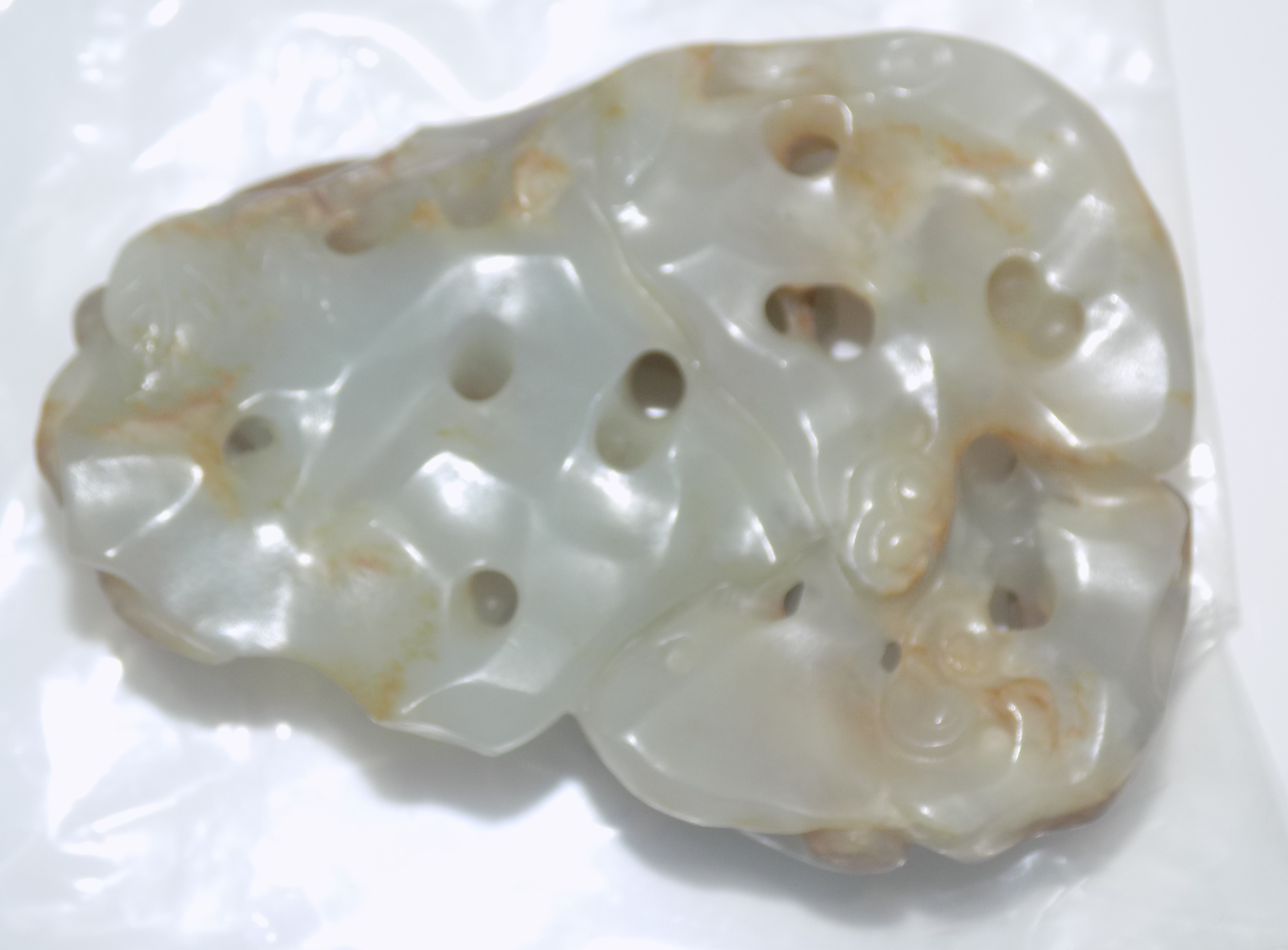 A Chinese mottled white and brown jade pebble pierced and carved as a a squirrel like mammal - Image 2 of 3