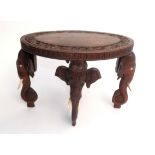 An Indian carved wood oval occasional table, early 20th century, of small proportions,