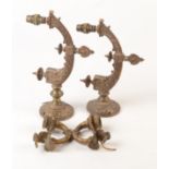 Two pairs of cast brass light brackets.