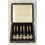 A set of six silver coffee spoons.