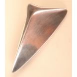 A Georg Jensen silver brooch no. 327 of sail form designed by Henning Koppel.