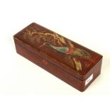 A Japanese red lacquered work box, circa 1900, decorated with an exotic bird and seal marks,