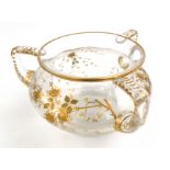 A gilt floral decorated cut glass bowl, 19th century, with three handles, height 16.