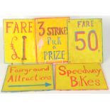 Five small painted fairground signs.