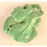 A Chinese carved turquoise pendant. Condition report: No damage.