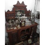 An oak mirror back sideboard, circa 1900, height 188cm, width 43cm, depth 63.5cm.