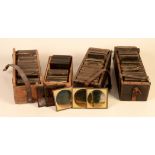 Four boxes of Victorian magic lantern slides, including cartoons, mermaids, boys at sea,