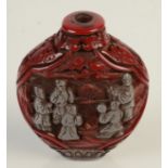 A cinnabar and silvered snuff bottle, height 6.5cm.