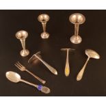 A silver baby spoon and pusher each with yellow enamelled motif boxed, together with other silver.