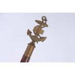 A Boys Brigade ceremonial wooden staff with brass mount in the form of an anchor inscribed 'Sure &