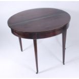 A George III mahogany demi lune tea table, the fold over top on square tapering supports,