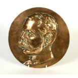 A circular bronze portrait plaque of Kitchener, diameter 26.5cm.