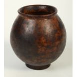 An Earthenware tribal pot, possibly South American, height 14.5cm.