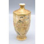 A Japanese Satsuma hexagonal pottery vase, gilt decorated with warriors and figures on a balcony,