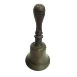 A Victorian bronze bell, with turned wood handle, height 25cm.