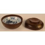A Chinese blue and white porcelain dish, blue mark to base, in a wooden circular lidded box,