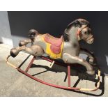 A post war sheet metal rocking horse.