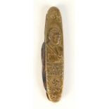 A German WWII folding pocket knife the brass frame designed with a bust portrait of Hitler and