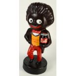 A Golden Shred golly shop display figure, holding a jar of Robertson's Golden Shred marmalade,