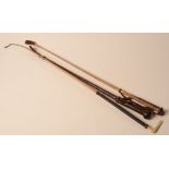 A brown leather riding crop, length 59.5cm and two other crops.