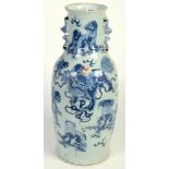 A Chinese celadon vase, 19th century, decorated with dogs of fo, height 54cm.