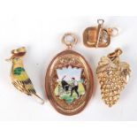 An enamelled 9ct gold trophy pendant and three other pendants.