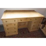 A Victorian pine pedestal desk, with an arrangement of drawers on a plinth base, height 74cm,