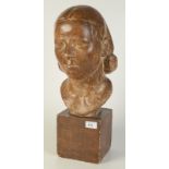 A bronzed plaster female bust.