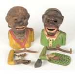 Two 'jolly nigger' money boxes.
