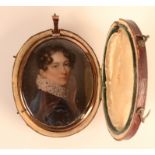 An 18th century portrait miniature of a young woman, her hair in ringlets,