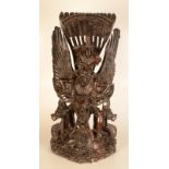 A large Indonesian carved wood figure of Vishnu riding Garuda, early 20th century,