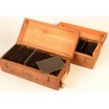 Two boxes of glass photographic slides, including Devon and Somerset scenes, dated 1898 and 1899,